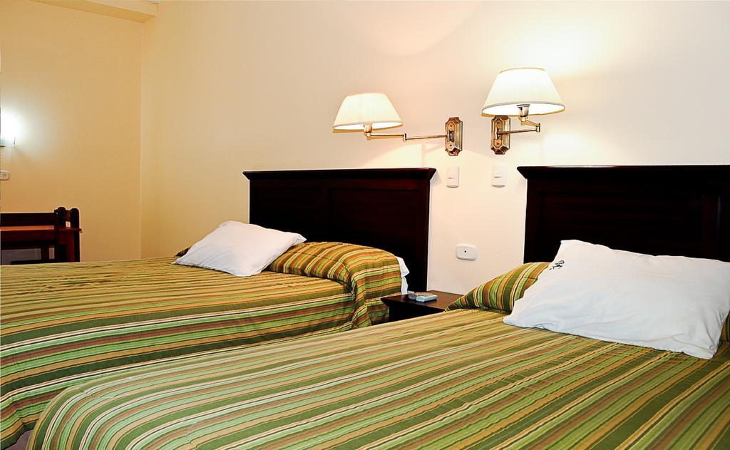 Hotel Presidente Selva La Merced  Habitación foto